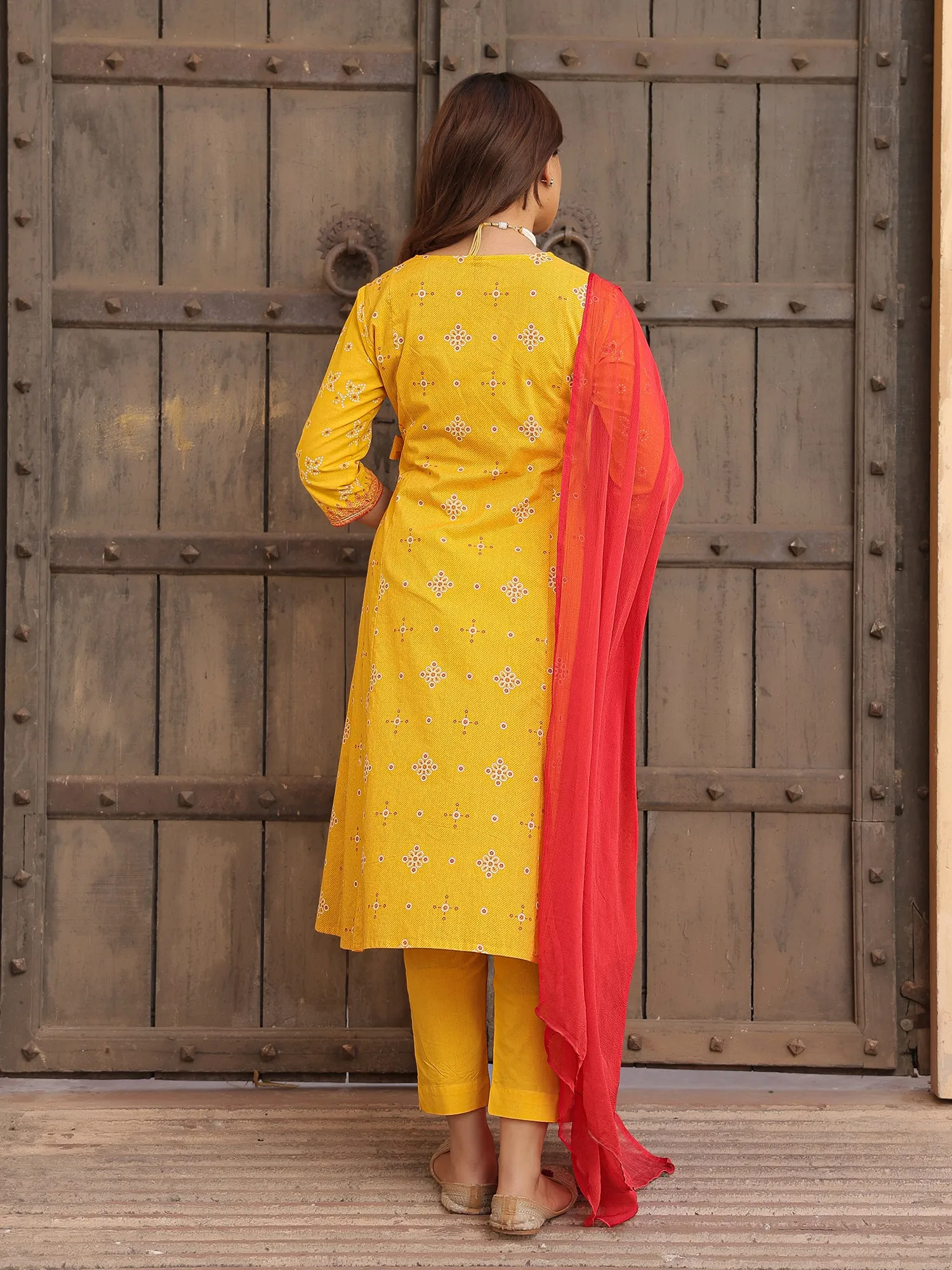 Juniper Mustard Bandhani Print Angrakha Cotton Kurta With Pants & Dupatta Set With Mirror Work Embroidery