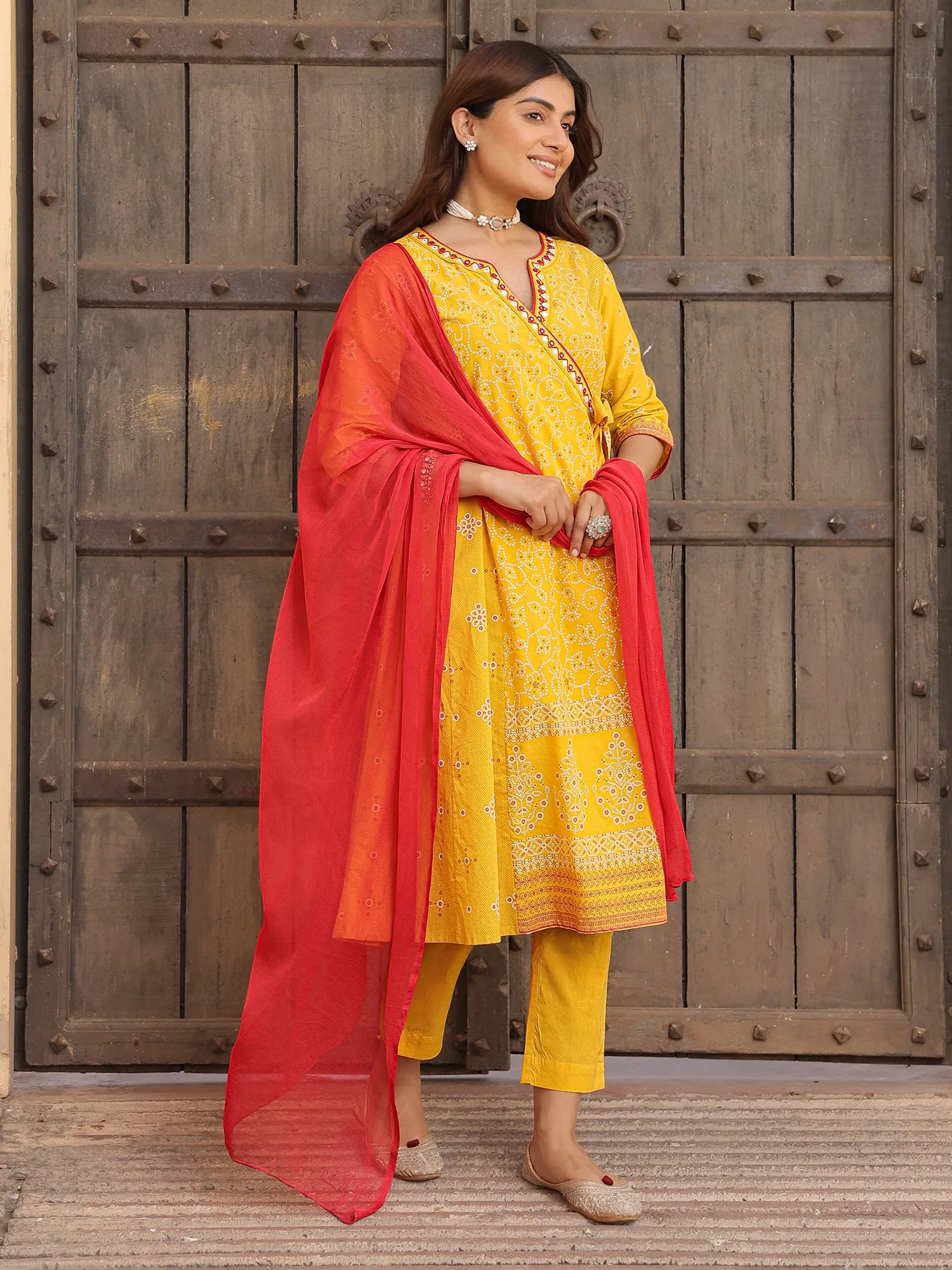 Juniper Mustard Bandhani Print Angrakha Cotton Kurta With Pants & Dupatta Set With Mirror Work Embroidery